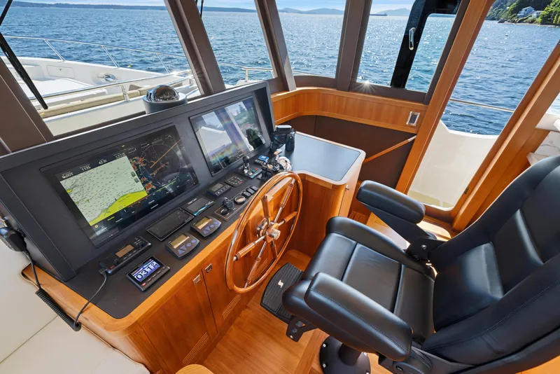 Slide: The Image of Helm of 2026 Selene 60 Ocean Explorer yacht with navigation screens and leather captain's chair. - 16