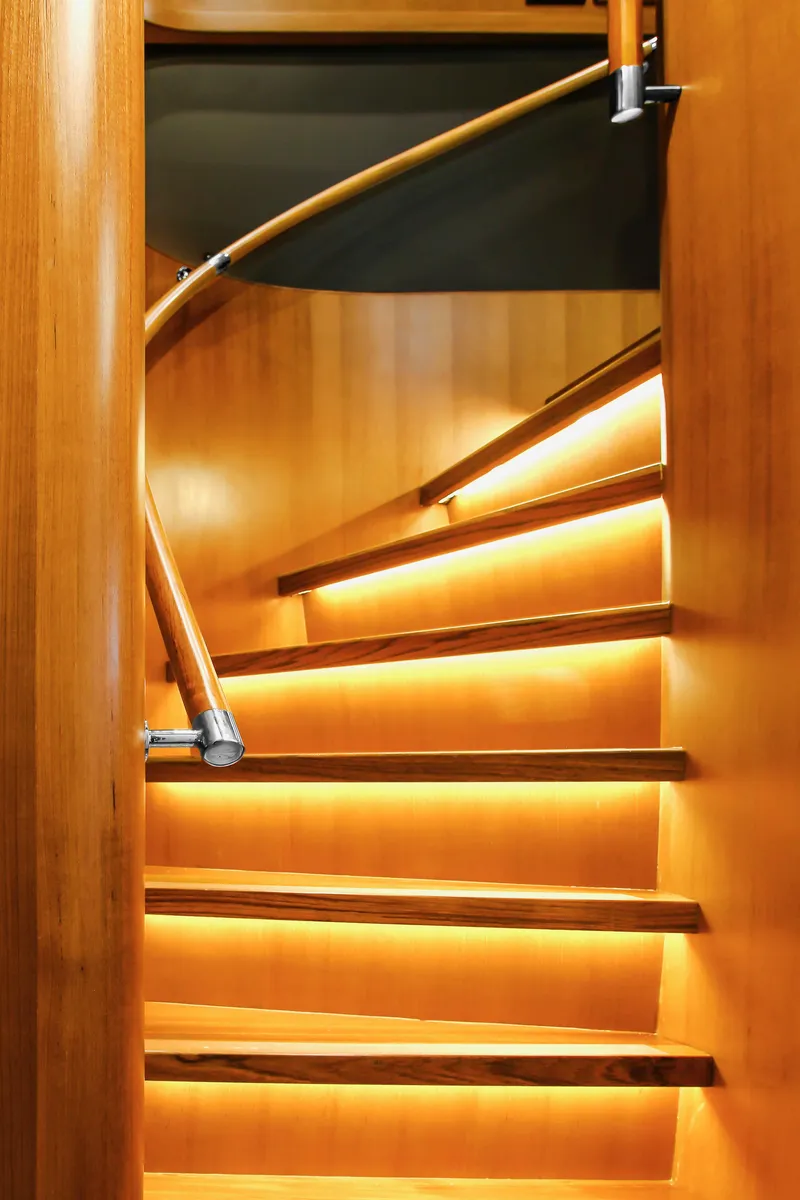 Slide: The Image of Luxurious wooden staircase on 2026 Selene 60 Ocean Explorer yacht, featuring elegant lighting. - 9