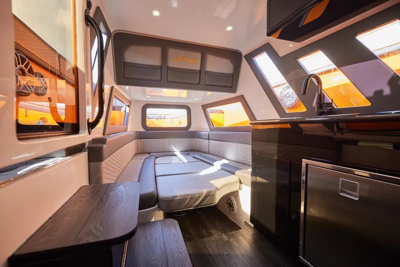 Slide: The Image of Luxurious interior of 2023 Midnight Express 43' Solstice yacht with modern seating and kitchenette. - 18