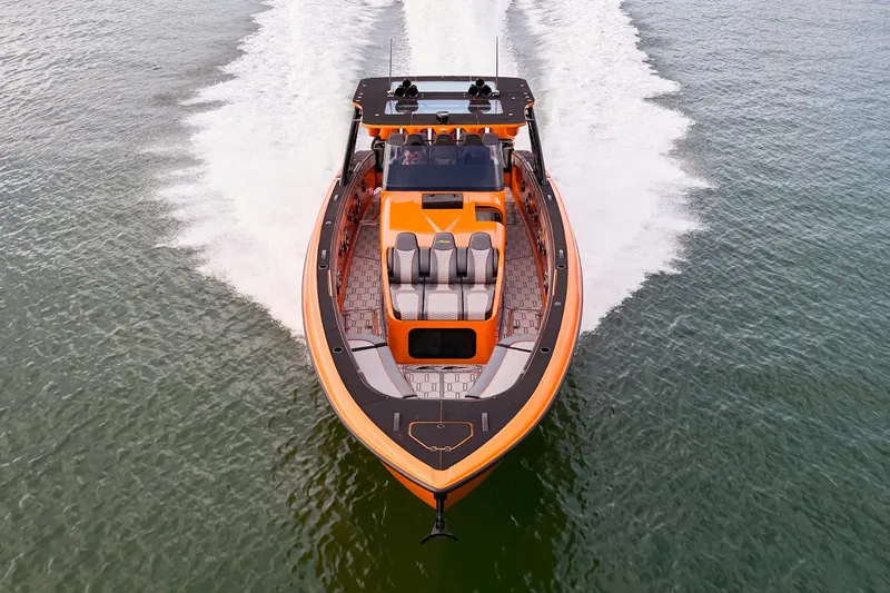 Slide: The Image of 2023 Midnight Express 43' Solstice boat cruising on open water, aerial view. - 4