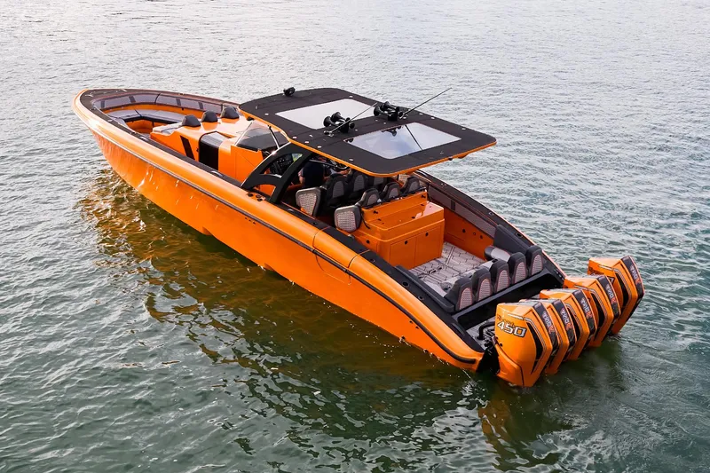 Slide: The Image of 2023 Midnight Express 43' Solstice boat in vibrant orange on water. - 7
