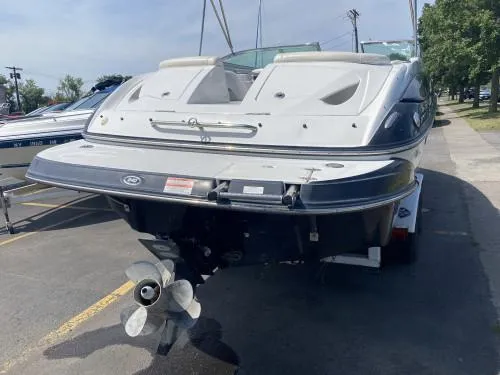 Slide: The Image of 2010 Crownline 240 LS boat rear view with propeller and trailer. - 3