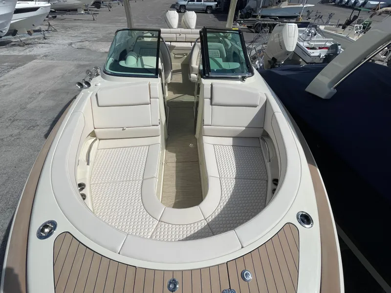 Slide: The Image of 2024 Chris-Craft Launch 31 GT boat with luxurious seating and spacious deck. - 14