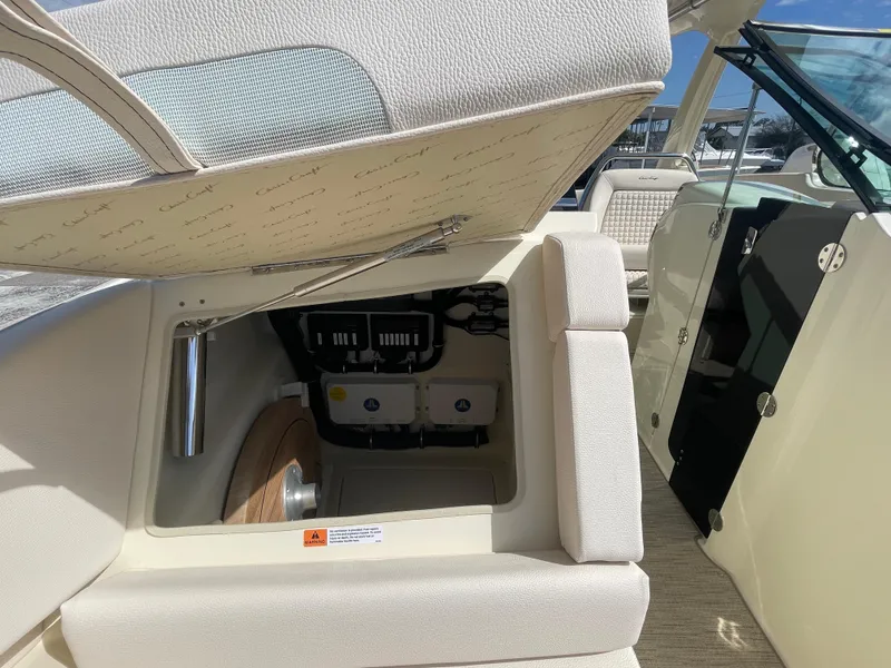 Slide: The Image of 2024 Chris-Craft Launch 31 GT boat interior with open storage compartment. - 15