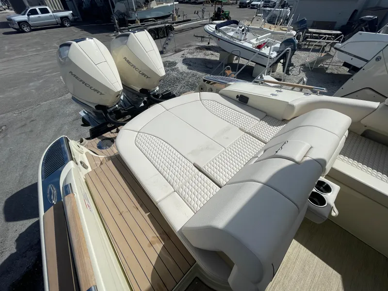 Slide: The Image of 2024 Chris-Craft Launch 31 GT boat with twin Mercury outboard engines and luxurious seating. - 4