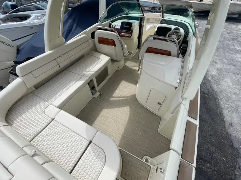 Slide: The Image of 2024 Chris-Craft Launch 31 GT boat interior with luxurious seating and modern dashboard. - 5