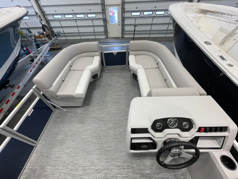 Slide: The Image of 2024 Godfrey Xperience 1880 FX pontoon boat interior with spacious seating and modern helm. - 12