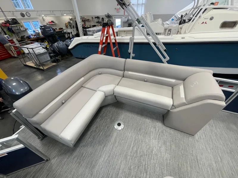 Slide: The Image of 2024 Godfrey Xperience 1880 FX boat interior with gray seating in showroom - 17