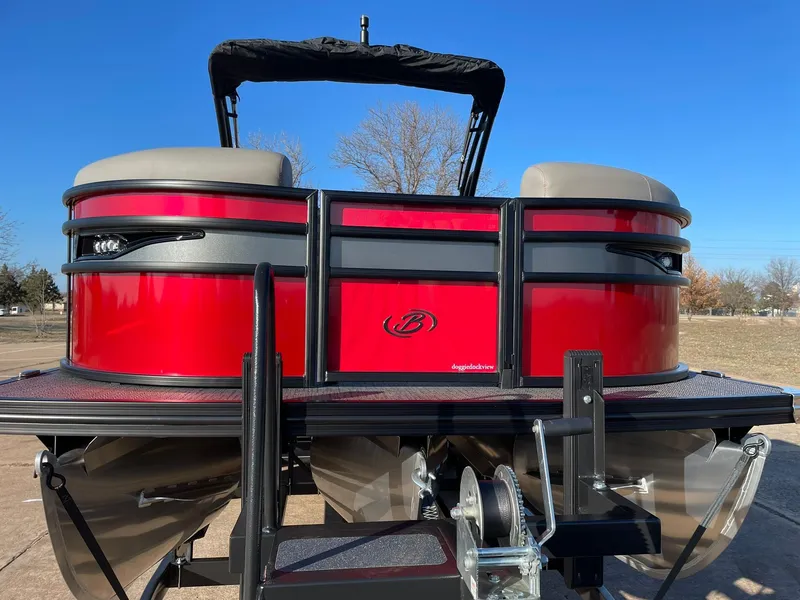 Slide: The Image of 2024 Barletta CORSA 23UCA pontoon boat, rear view, red and black design. - 17