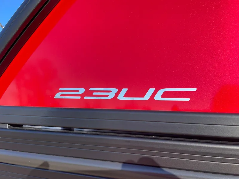 Slide: The Image of 2024 Barletta CORSA 23UCA boat model emblem on red background - 18