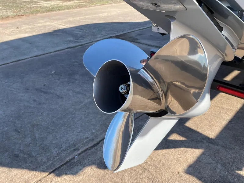 Slide: The Image of Close-up of 2024 Barletta CORSA 23UCA boat propeller on a concrete surface. - 19