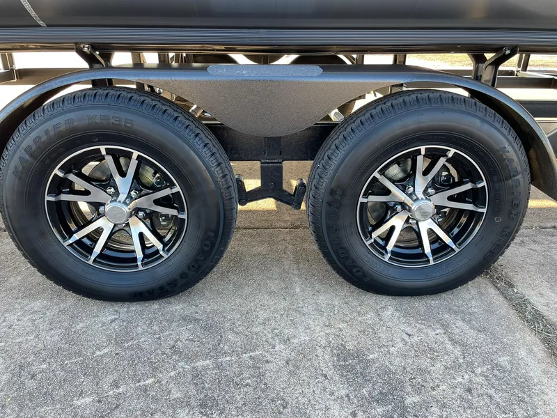 Slide: The Image of 2024 Barletta CORSA 23UCA trailer wheels and tires on pavement. - 21