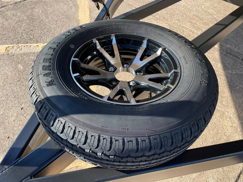 Slide: The Image of 2024 Barletta CORSA 23UCA trailer tire and wheel on pavement. - 22