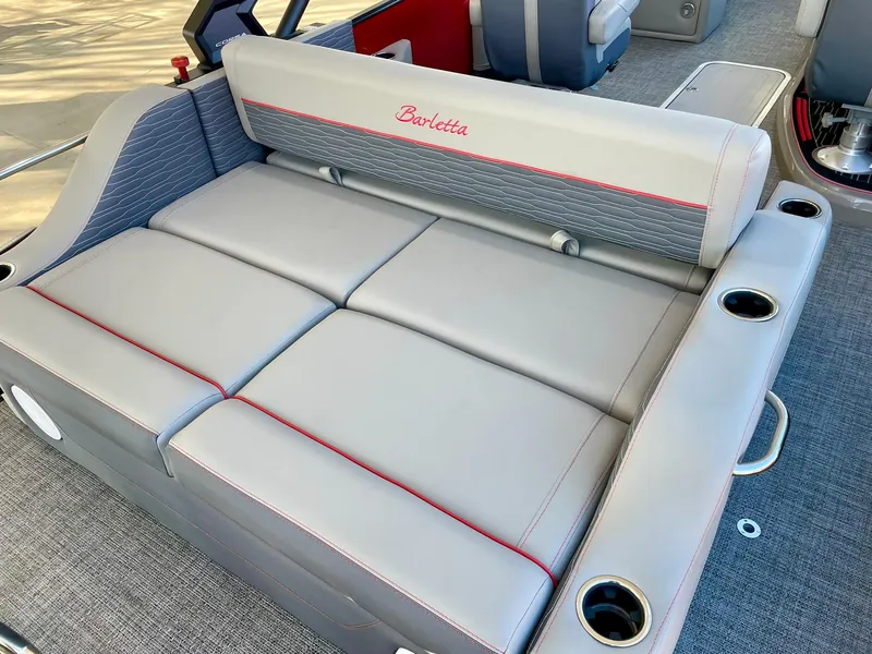 Slide: The Image of 2024 Barletta CORSA 23UCA boat interior with gray and red cushioned seating. - 24