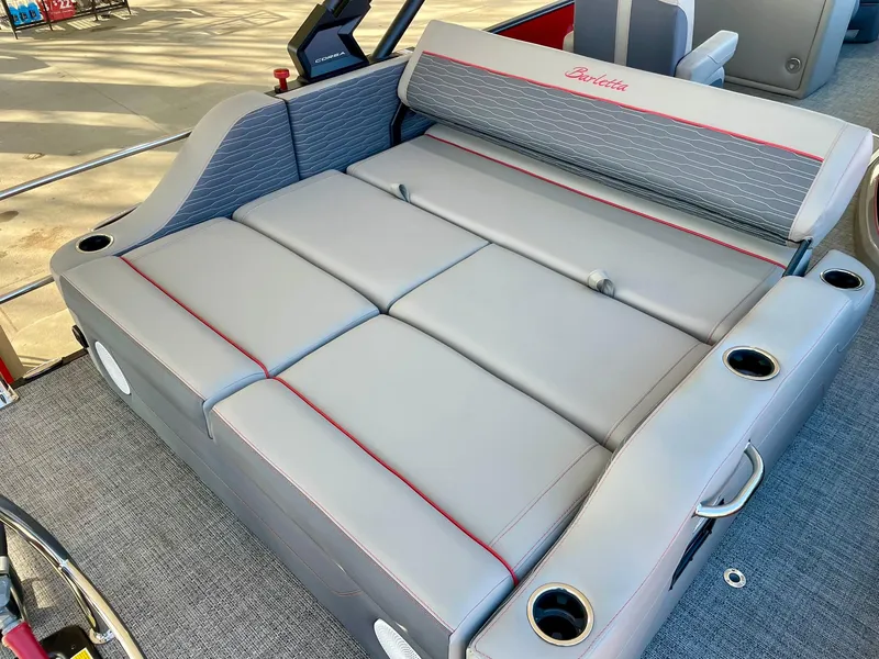 Slide: The Image of 2024 Barletta CORSA 23UCA boat interior with gray and red cushioned seating. - 39