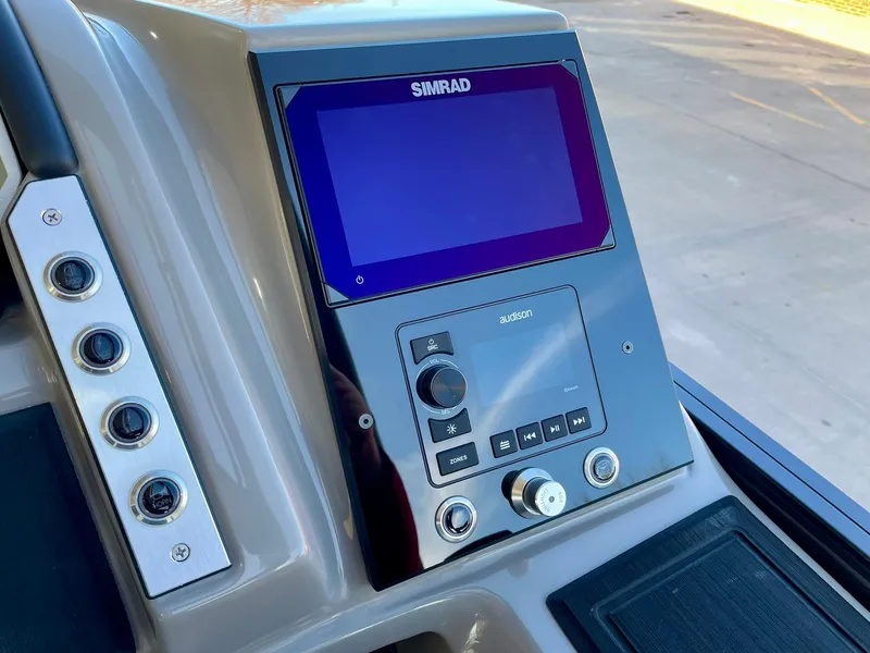 Slide: The Image of 2024 Barletta CORSA 23UCA boat dashboard with Simrad display. - 45