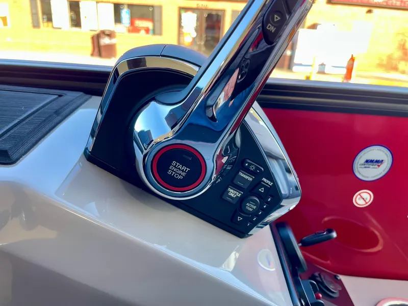 Slide: The Image of 2024 Barletta CORSA 23UCA boat throttle control with start/stop button. - 46