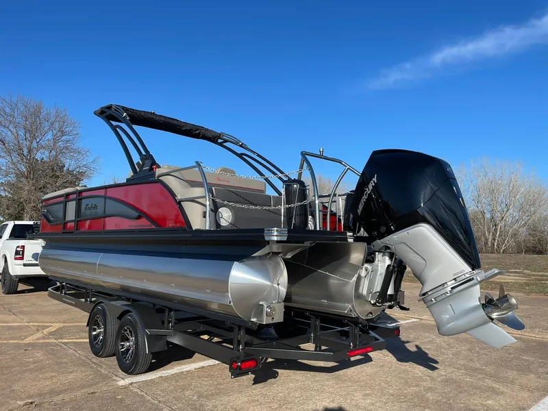 Slide: The Image of 2024 Barletta CORSA 23UCA pontoon boat on a trailer, rear view. - 8