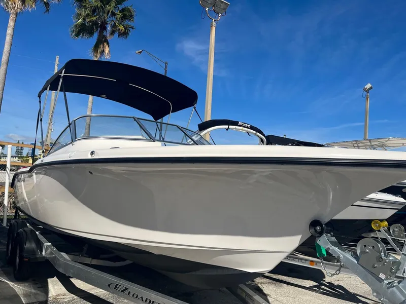 The Image of 2020 Key West 239 DFS boat on trailer under blue sky. - 0