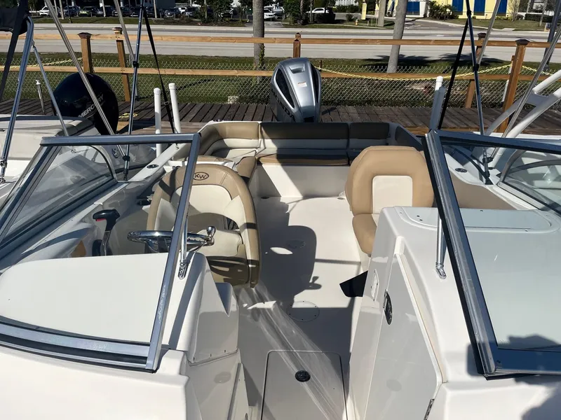 Slide: The Image of 2020 Key West 239 DFS boat interior with seating and steering wheel. - 11