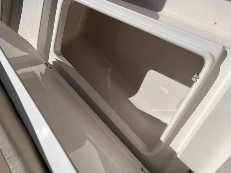 Slide: The Image of Open storage compartment on a 2020 Key West 239 DFS boat. - 5
