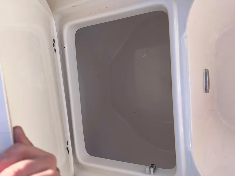 Slide: The Image of Open storage compartment on 2020 Key West 239 DFS boat. - 6