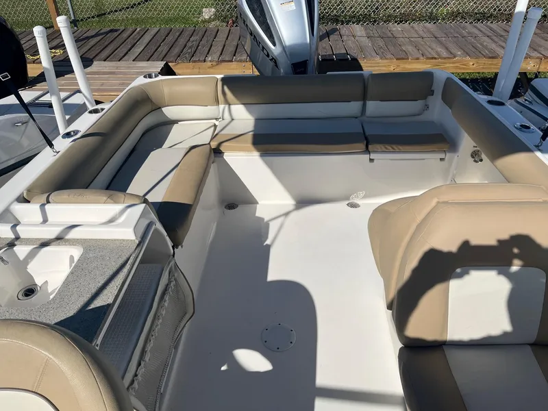 Slide: The Image of 2020 Key West 239 DFS boat interior with beige seating and white deck. - 9