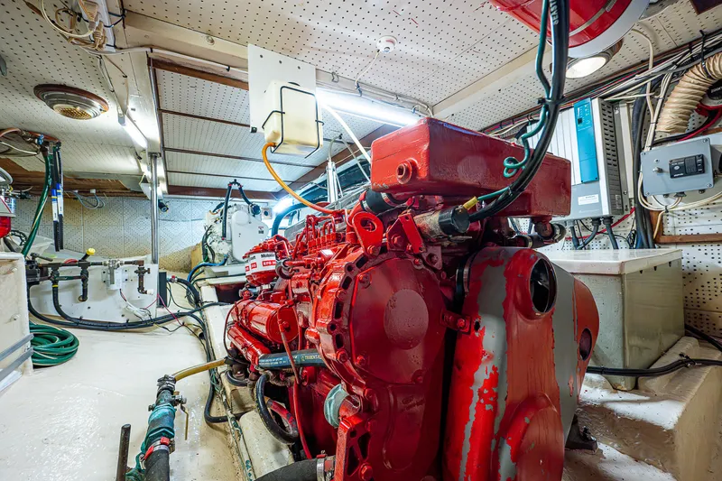Slide: The Image of Engine room of a 1983 Krogen 42 boat with a red engine. - 19