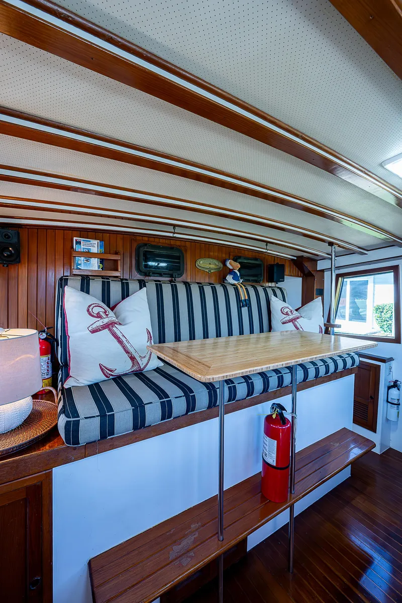 Slide: The Image of Interior of 1983 Krogen 42 yacht with striped seating and nautical decor. - 35
