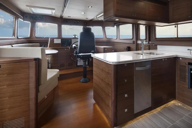 Slide: The Image of Luxurious interior of 2026 Selene 72 Classic Explorer yacht with modern kitchen and helm. - 10