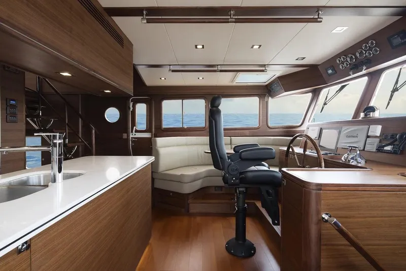 Slide: The Image of Interior of 2026 Selene 72 Classic Explorer yacht with modern helm and seating. - 11