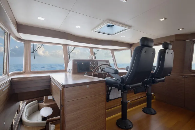Slide: The Image of Interior of 2026 Selene 72 Classic Explorer yacht with modern helm and ocean view. - 13