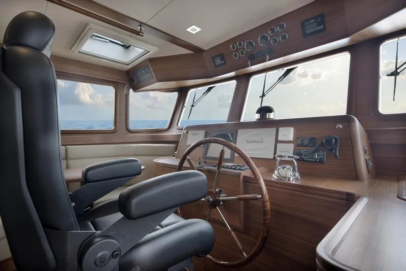 Slide: The Image of Interior of 2026 Selene 72 Classic Explorer yacht with steering wheel and navigation equipment. - 15