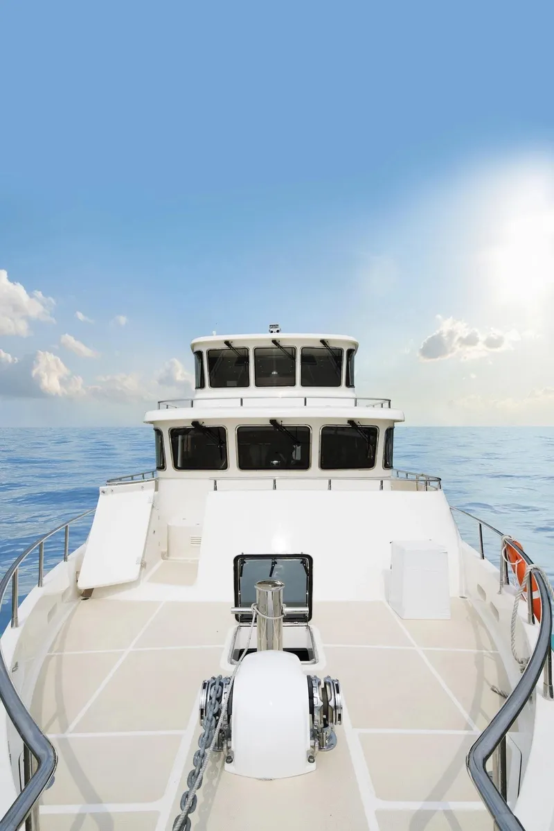 Slide: The Image of Selene 72 Classic Explorer yacht cruising on open sea under clear blue sky. - 2