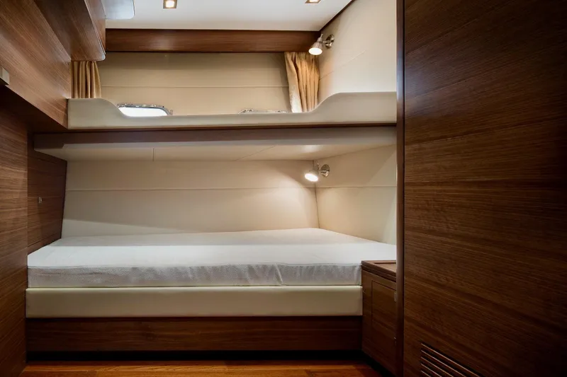 Slide: The Image of Interior of 2026 Selene 72 Classic Explorer yacht with wooden bunk beds and modern lighting. - 21