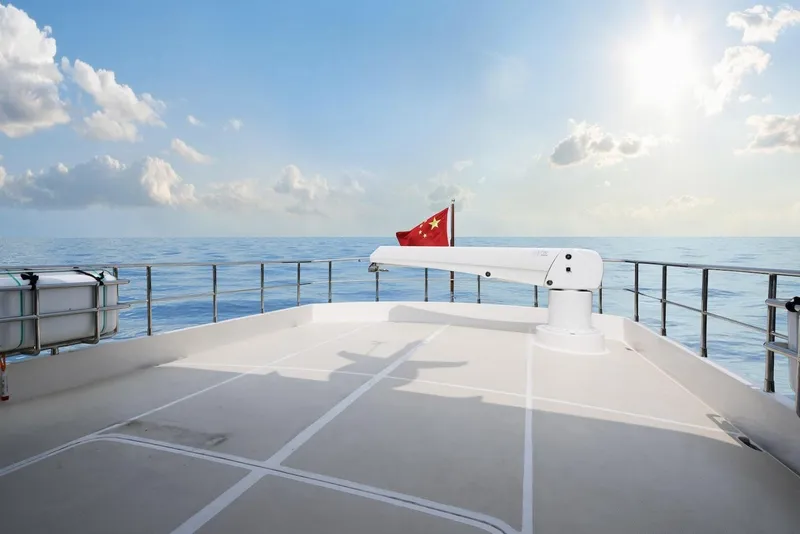 Slide: The Image of Selene 72 Classic Explorer yacht deck with ocean view, 2026 model, under clear sky. - 5