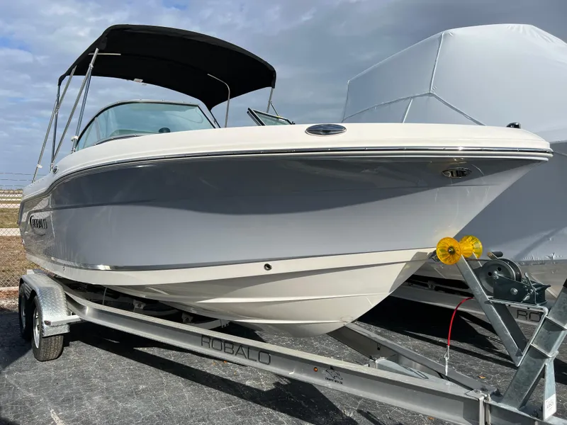 The Image of 2024 Robalo R207 Dual Console boat on a trailer. - 0