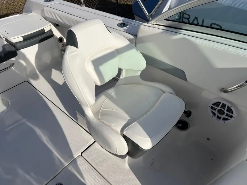 Slide: The Image of 2024 Robalo R207 Dual Console boat interior with white captain's chair. - 13