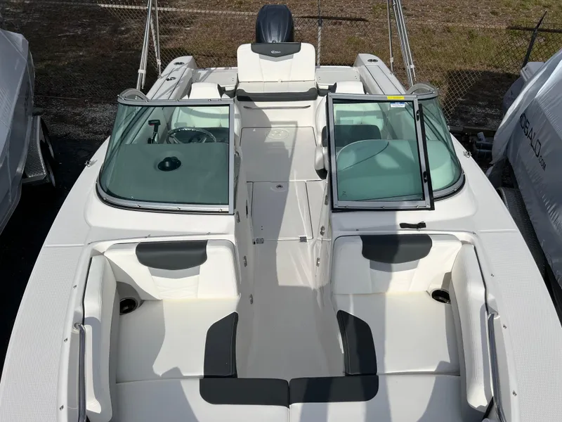 Slide: The Image of 2024 Robalo R207 Dual Console boat with open seating and windshield. - 8