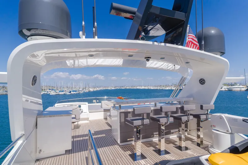 Slide: The Image of Flybridge of 2016 Van der Valk 78 Motor Yacht with bar stools and ocean view. - 23