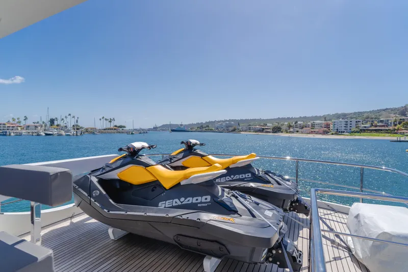 Slide: The Image of Two Sea-Doo jet skis on the deck of a 2016 Van der Valk 78 Flybridge Motor Yacht. - 26