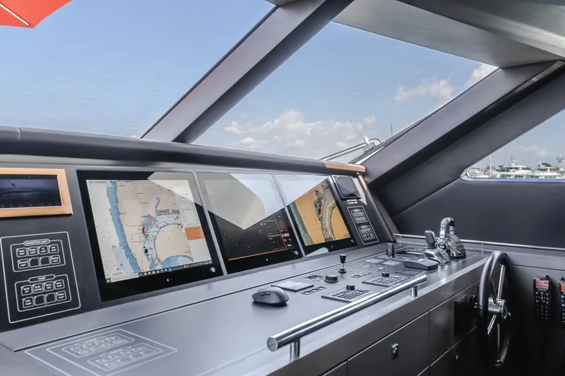Slide: The Image of Helm station of 2016 Van der Valk 78 Flybridge Motor Yacht with navigation screens. - 38
