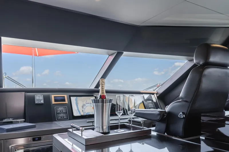 Slide: The Image of Luxurious helm of 2016 Van der Valk 78 Flybridge Motor Yacht with champagne. - 39