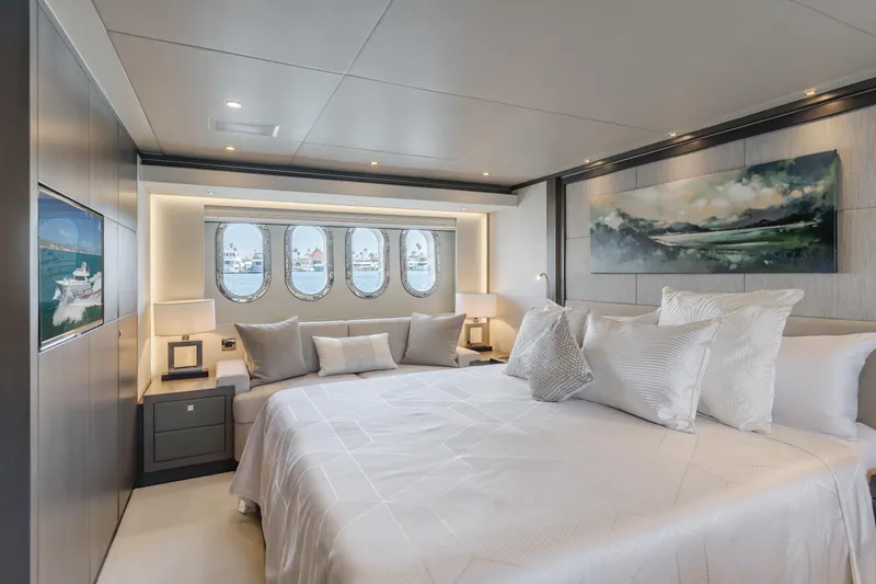 Slide: The Image of Luxurious bedroom on 2016 Van der Valk 78 Flybridge Motor Yacht with ocean view portholes. - 49