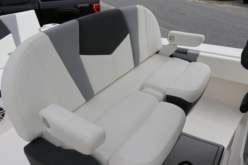 Slide: The Image of 2024 Robalo 266 Cayman boat seating with gray and white upholstery. - 16