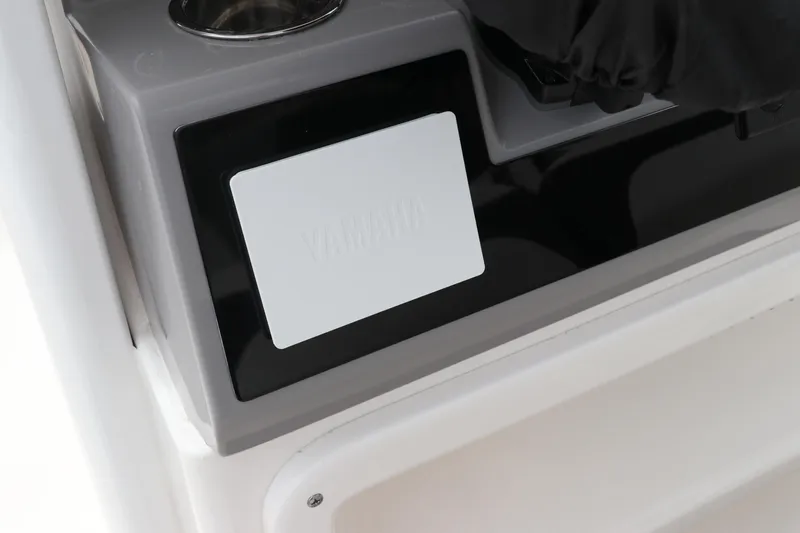 Slide: The Image of 2024 Robalo 266 Cayman boat console detail with cup holder. - 19