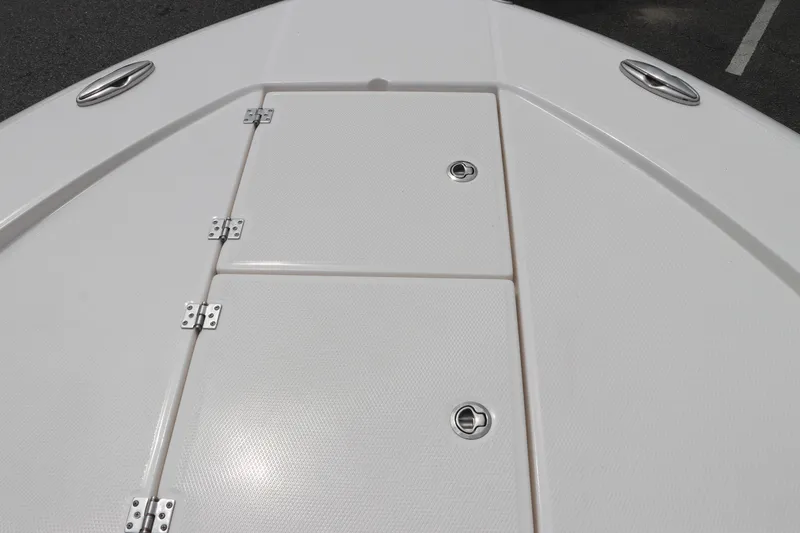 Slide: The Image of 2024 Robalo 266 Cayman boat deck with storage compartments. - 27