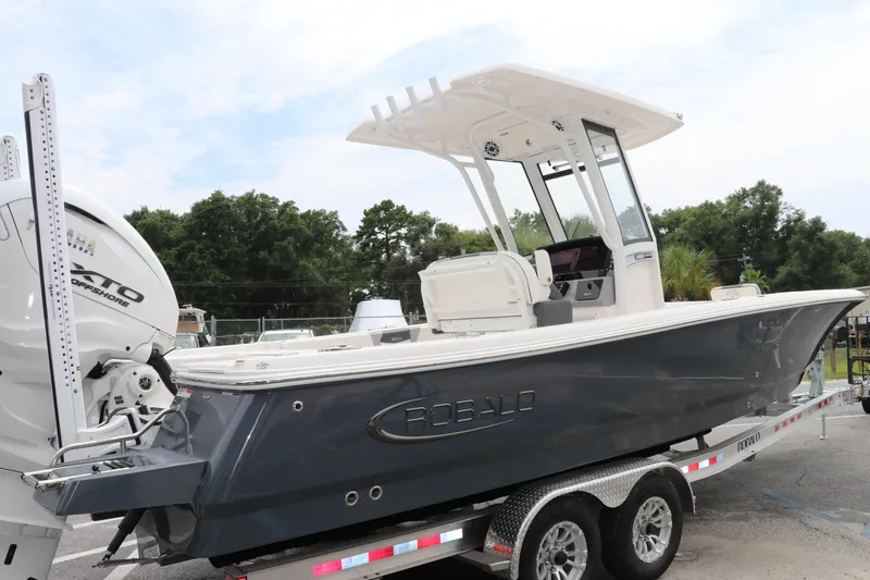Slide: The Image of 2024 Robalo 266 Cayman boat on trailer, side view, outdoors. - 5