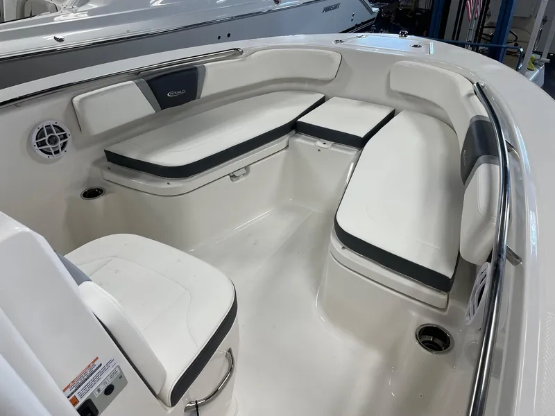 Slide: The Image of 2024 Robalo R200 Center Console boat interior with white and gray seating. - 12