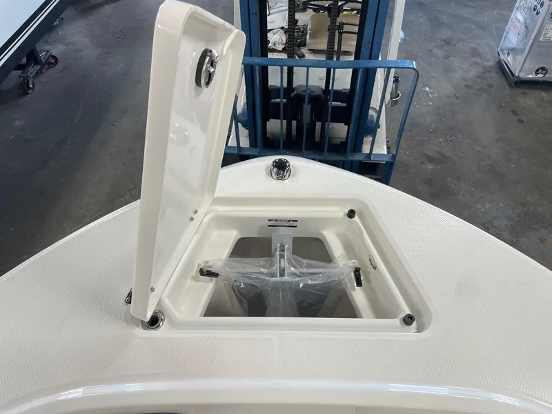 Slide: The Image of 2024 Robalo R200 Center Console boat anchor storage compartment. - 19